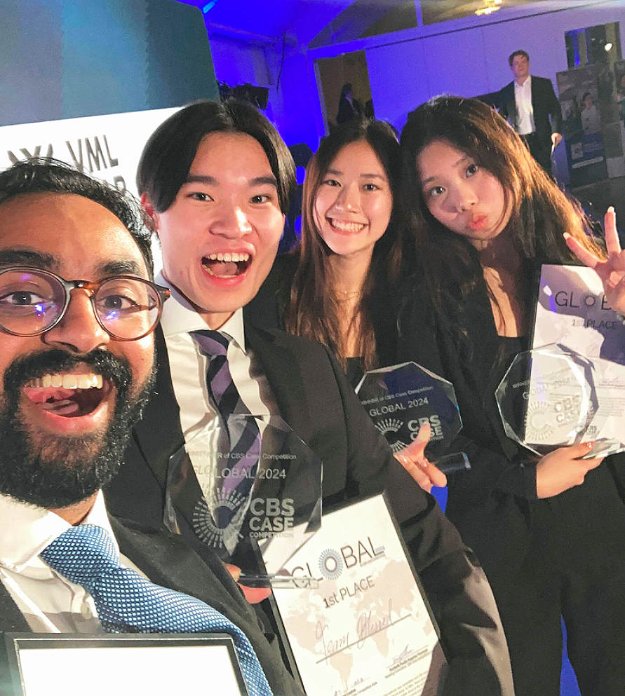 4 Rotman Commerce students celebrating their case competition win