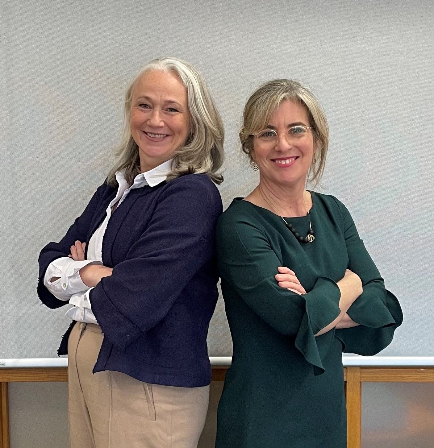 Two women standing side by side